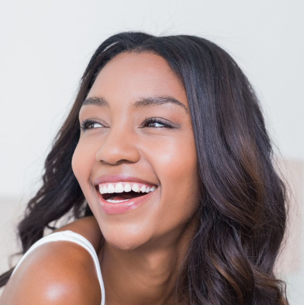 group of young adults smiling and laughing